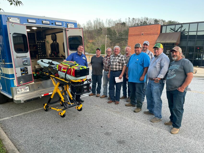 NARMC Emergency Medical Services Director Scotty Trammell demonstrated the operation of the lift system of the county's new $200,000 ambulance to county officials following the April 3 quorum court meeting in Jasper. JEFF DEZORT/STAFF