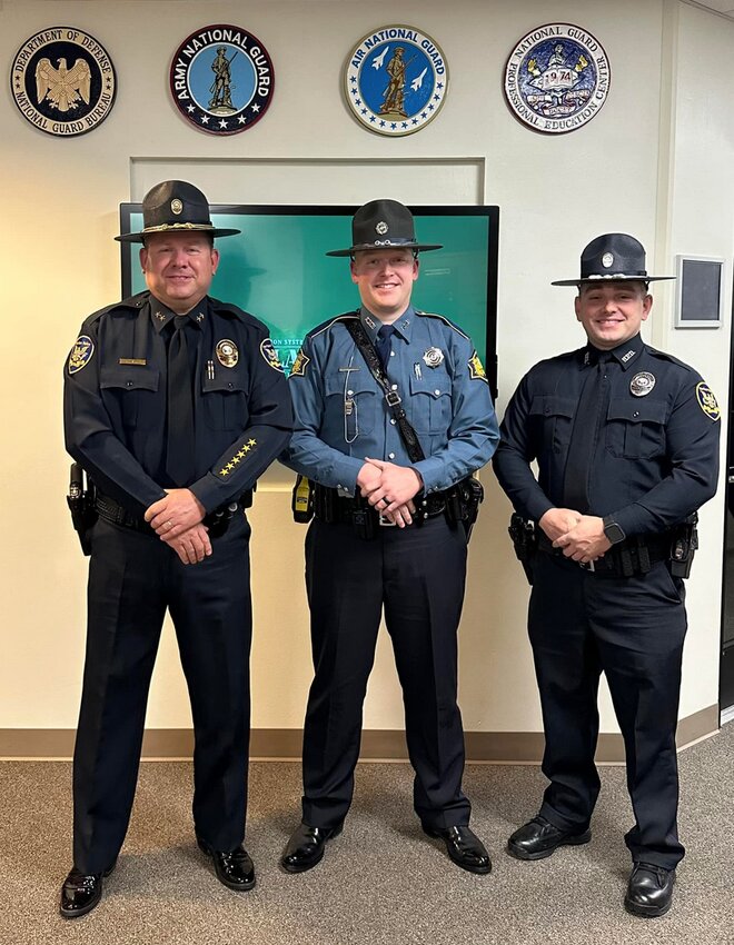 CONTRIBUTED PHOTO   HPD Chief Chris Graddy (left) congratulates Jared Curtis for graduating from the Arkansas State Police Academy with Patrolman Steve Bodine (right). Curtis has been a patrolman for the Harrison Police Department prior to attending the academy.