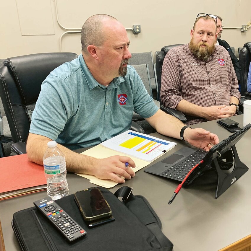 Jason Brisco, Boone County Emergency Management Director (left) and Daniel Bolen, Boone County 911 Director (right) discuss emergency planning at the Boone County Local Emergency Planning Committee meeting, Wednesday, Jan. 31, in Harrison.
