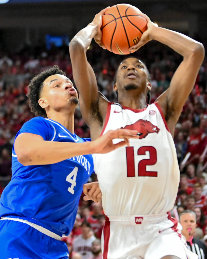 Razorback junior guard Tramon Mark (12) goes up for two against Kentucky inside Bud Walton Arena in Fayetteville last Saturday. On Wednesday, Mark scored 22 points to lead the Razorbacks to a 91-84 victory over Missouri. CRAVEN WHITLOW/NATE ALLEN SPORTS SERVICES