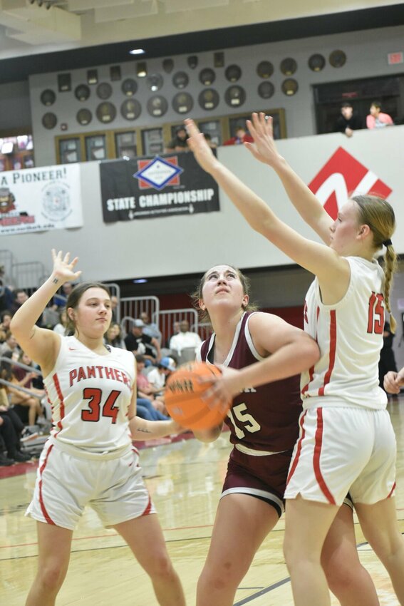 Alpena&rsquo;s Yaiza Gonzalaz (middle) tries to get a shot against Norfork on Tuesday night in the Class 1A State Basketball Tournament at North Arkansas College. The Lady Leopards lost the contest.&nbsp;JEFF BRASEL/STAFF