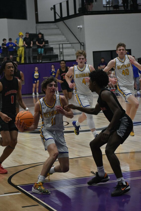 Dylan Friend (middle) drives the lane against Lisa North Academy on Tuesday night. Friend led the Panthers to a win over the Jaguars. JEFF BRASEL/STAFF