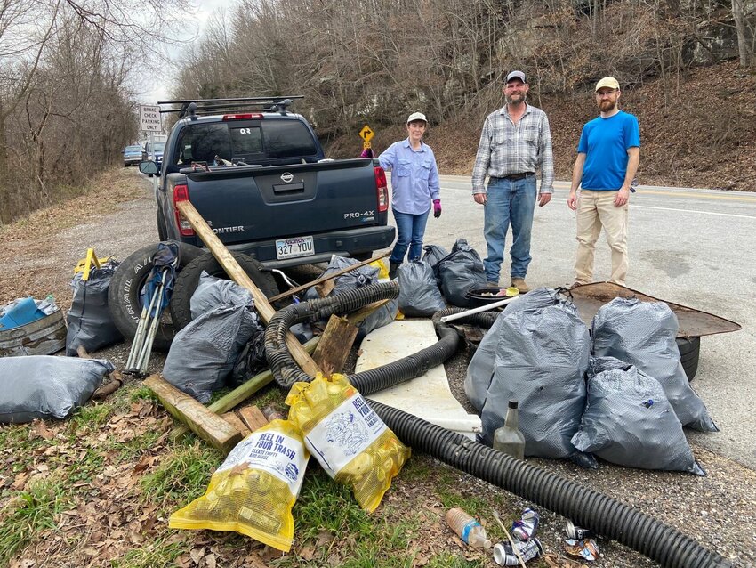 Volunteers display litter removed from a dumping site in Newton County. CONTRIBUTED PHOTO