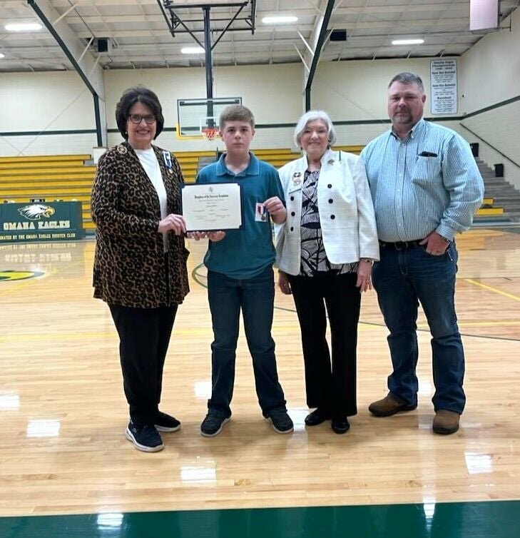 Lucas Crow of Omaha Middle School, is presented with his award in the NSDAR American History Essay Contest, March 8. (From left) Janice Duffy, Lucas Crow, Sandra Hillier, Bill Melbourne, Dist. 10 Boone County JP CONTRIBUTED PHOTO