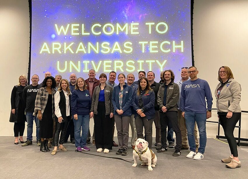 Leaders from Arkansas Tech University, the City of Russellville, the Russellville Tourism and Visitors Center and Pope County (as well as Jerry the Bulldog, ATU campus ambassador) posed for a photo with the NASA team visiting ATU and Russellville for the April 8 total solar eclipse during a welcome reception on Wednesday, April 3. An outreach team from NASA and a group of astronomers from the Paris Observatory in France arrived on campus last week and stayed at ATU to observe the eclipse on Monday, April 8. CONTRIBUTED PHOTO