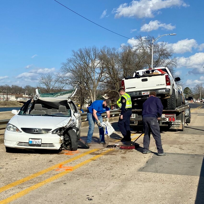 A crew cleans up following the wreck of a Chevy Silverado that ran into a Toyota Camry on Feb. 8. The driver of the truck is facing several charges, including DWI, and further charges may now follow after the death of the Toyota driver from injuries. LORETTA KNIEFF / STAFF
