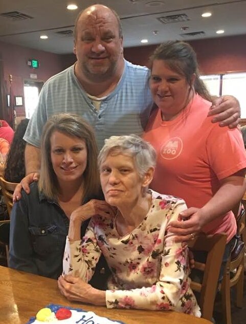 Cheryl, Scott and Kim (from left) and mother Shirley (seated, center)