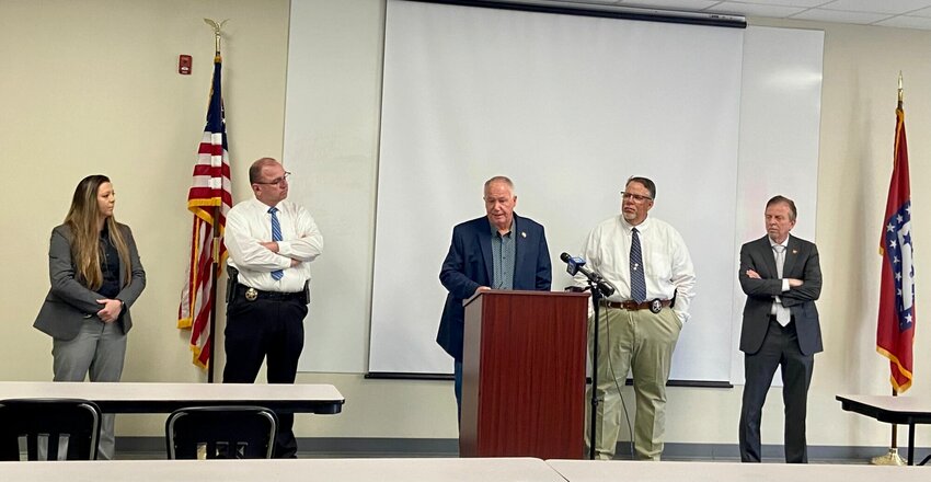 (From left) Shauna Isbell and Brent Jones, of Boone County's Criminal Investigations Division, join Sheriff Roy Martin and Captain Bob King alongside 14th Judicial District Prosecuting Attorney, David Ethredge, at a press conference held on Friday, May 17. LORETTA KNIEFF / STAFF