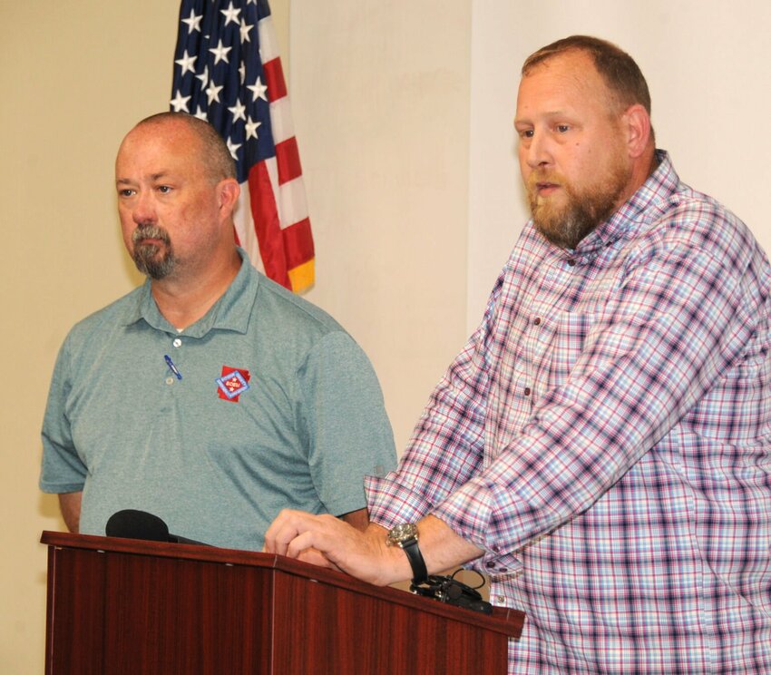 Jason Brisco (left) and Daniel Boleyn present information about emergency recovery efforts at a press conference held on Thursday, June 6. The emergency personnel were joined by several officials who presented statements about the aftermath of the deadly storms which occurred on May 25.&nbsp; CONTRIBUTED PHOTO / LEE H. DUNLAP
