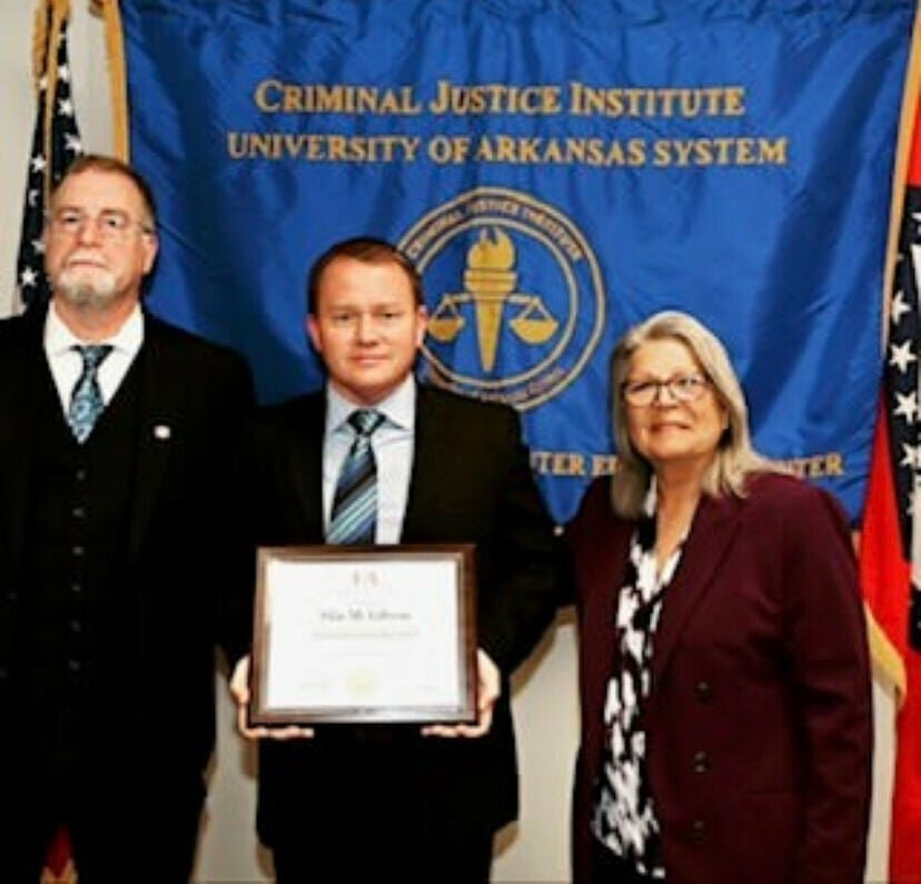 Investigator Sila Gibson (center) of the Marion County Sheriff's Office receives a certificate of completion of the Crime Scene Technician Program from the Criminal Justice Institute. CONTRIBUTED PHOTO