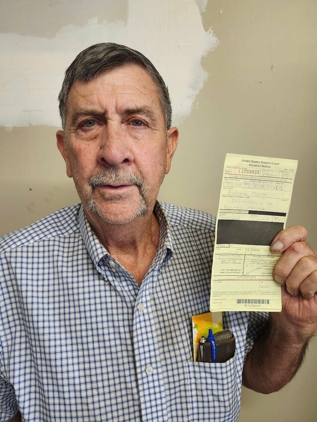 Marion County Justice of the Peace-elect Tommy Dean Johnson holds a written citation from the National Park Service he was served last July 28 at Buffalo Point. CONTRIBUTED PHOTO