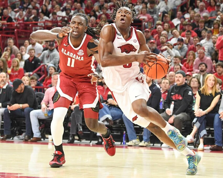 CRAEN WHITLOW/NATE ALLEN SPORTS SERVICES   Razorback junior forward Adou Thiero drives to the basket against Alabama inside Bud Walton Arena in Fayetteville Saturday night.
