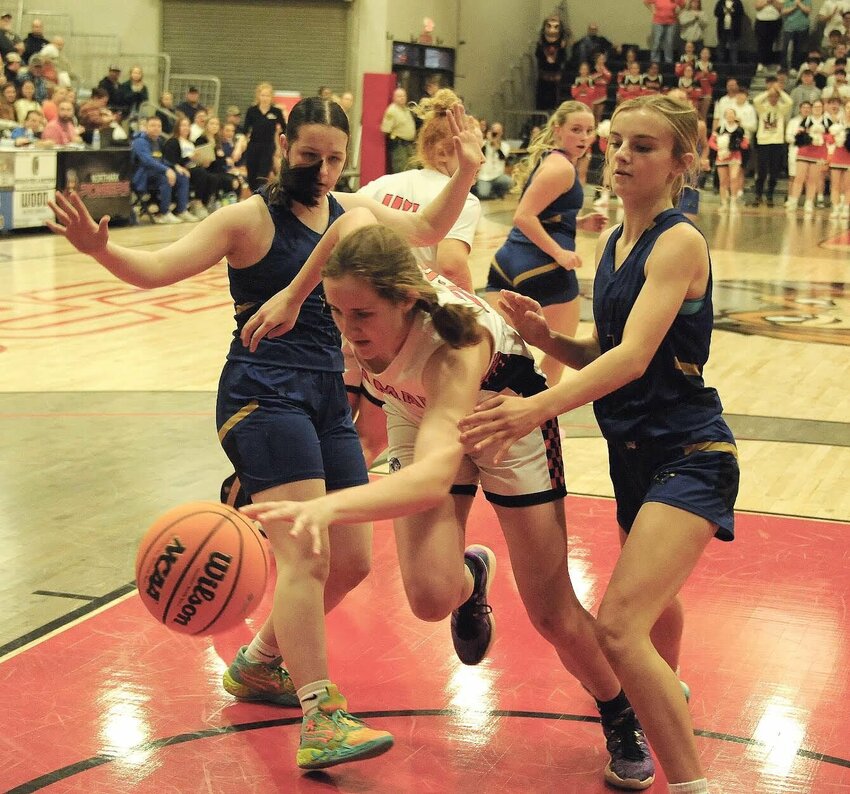 CONTRIBUTED PHOTO/LEE H. DUNLAP   Jacey Halitzka (left) and Makyna See of Bergman apply defense in the Class 3A State Basketball Tournament on Tuesday afternoon. The Lady Panthers lost to Lamar, 58-51, in the opening round.