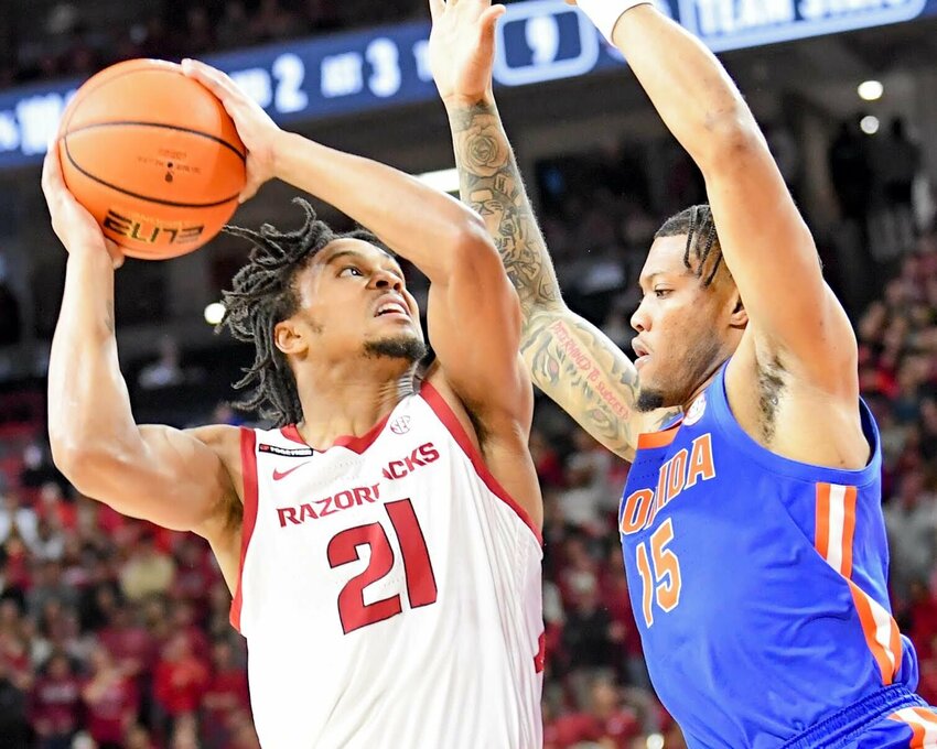CRAVEN WHITLOW/NATE ALLEN SPORTS SERVICE   Razorback sophomore guard D.J. Wagne goes strong to the basket against Florida inside Bud Walton Arena in Fayetteville.