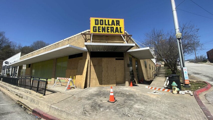 Dollar General on Rush in downtown Harrison is boarded up on Thursday, March 13. The building is set to be renovated and reopened as Dollar General. LORETTA KNIEFF / STAFF