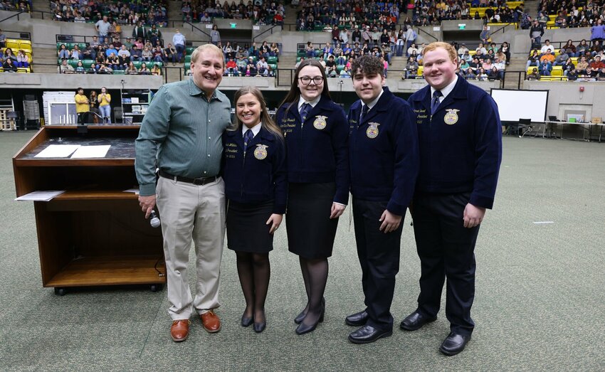 Arkansas Tech University President Dr. Russell Jones (left) posed for a photo with 2024-25 Future Farmers of America Arkansas state officers (from left-to-right) Josie Wilkins of Lamar (president), Rainlyn Trawick of Quitman (northwest district vice president), Haden Richardson of Mayflower (reporter) and Jonah Savell of Salem (eastern district vice president) during the opening session for the FFA event at Arkansas Tech on Thursday, March 13. CONTRIBUTED PHOTO