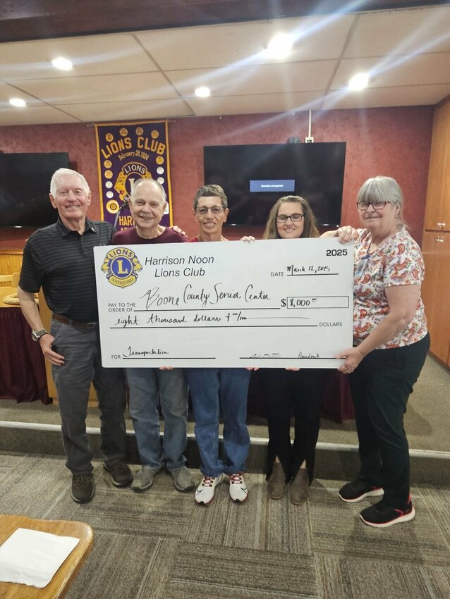 From left: Lion Ron Richardson, Lion Terry Yeager, President Lion Judy McCutcheon, Kelly Hunter and Pat Gomes — both of the Boone County Senior Activity &amp; Wellness Center. The Noon Lions Club members presented a check for $8,000, donated to the senior center to support their purchase of another transportation van. CONTRIBUTED PHOTO