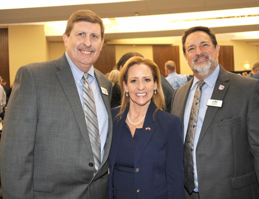Arkansas Lt. Governor Leslie Rutledge (center) is joined by Dr. Stewart Pratt (left) — the Chamber's Chairman of the Board and Jeffrey Nielsen (right) — the Chamber's CEO and President on March 18, at the "84th Annual Harrison Regional Chamber of Commerce Awards Luncheon" in Harrison. CONTRIBUTED PHOTO / LEE H. DUNLAP