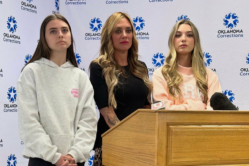 Dreu Kopf, who was wounded in a 2005 home invasion robbery, speaks to reporters, with her daughters, Gracie, left, and Rylee, after witnessing the execution of Wendell Grissom on Thursday, March 20, 2025, at the Oklahoma State Penitentiary in McAlester, Okla. CONTRIBUTED PHOTO
