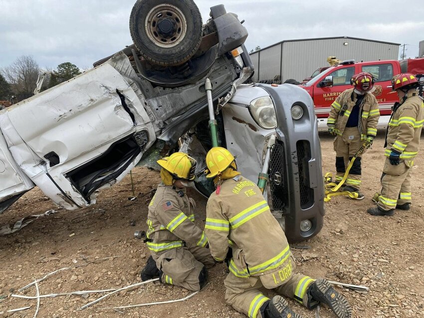 Harrison Fire Department personnel perform practice exercise in training that prepares them for extrication of individuals during automotive accidents. CONTRIBUTED PHOTO
