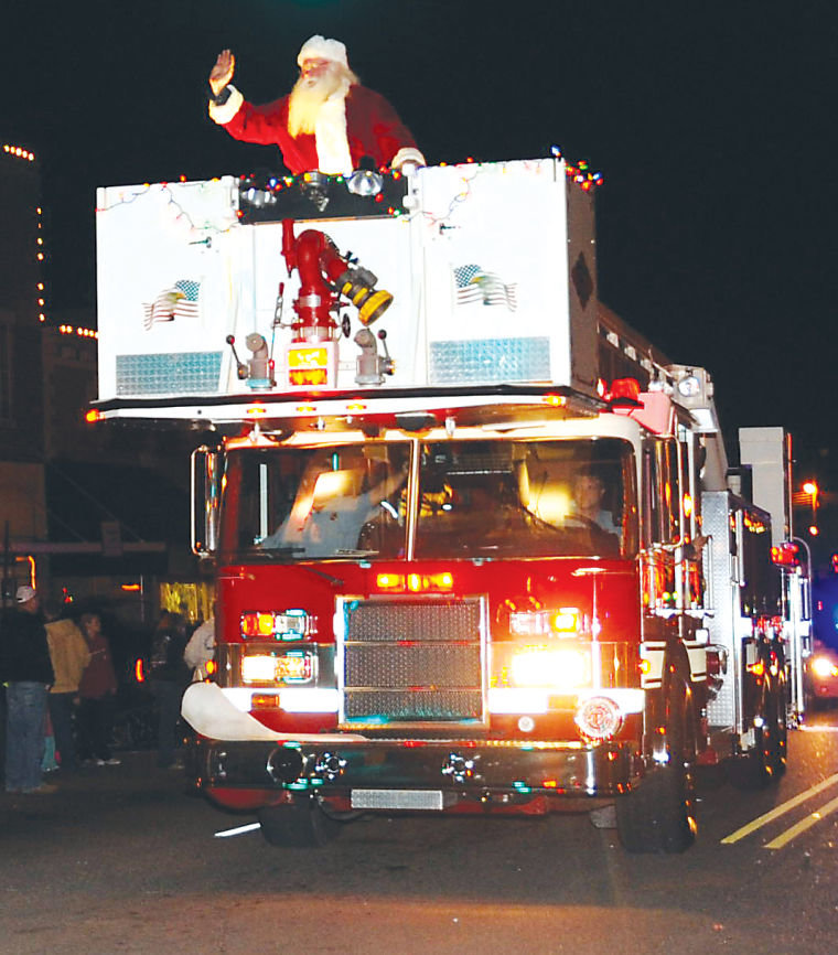 Christmas Parade lights up downtown; Six bands keep music flowing