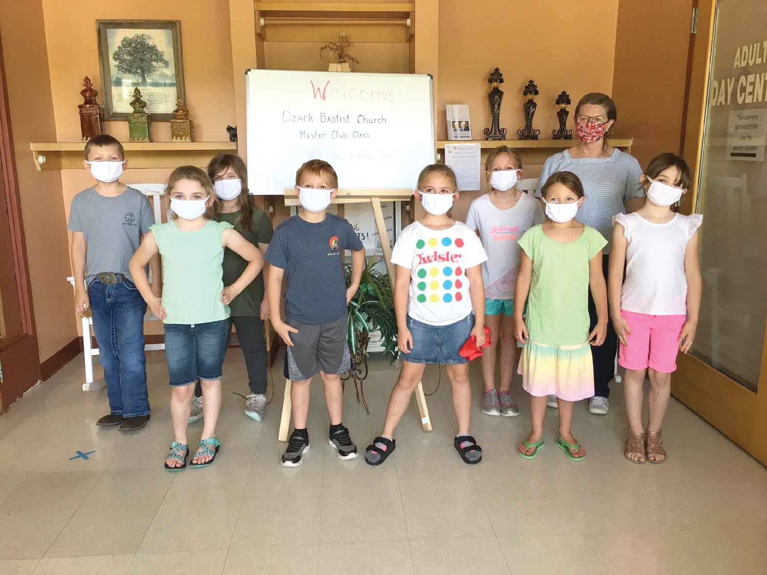 Kids from Ozark Baptist Church (front, from left) Maddie Miller, Jase Creamer, Jozee Caster, Evie Duncan and Liberty Miller (back) Logan Seeley, Kimber Adamson, Mackenzie Stiles and Teacher Nita Morrow served lunch at the Boone County Senior Activity and Wellness Center.