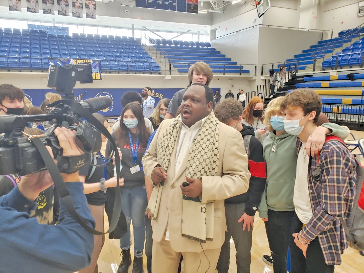 DuShun Scarbrough, executive director of the Arkansas Martin Luther King, Jr. Commission, was surrounded by students as he answered question after the MLK Birthday Bash on Friday.