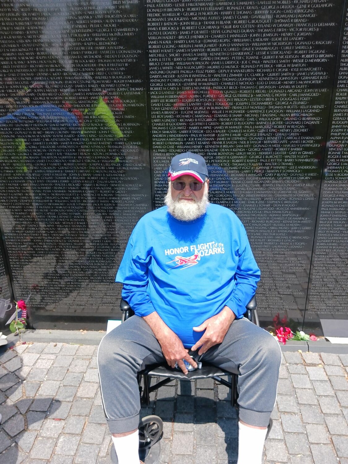 Wayne Cone sitting in front of the Memorial to the 58,000 killed in the Vietnam War. CONTRIBUTED PHOTO