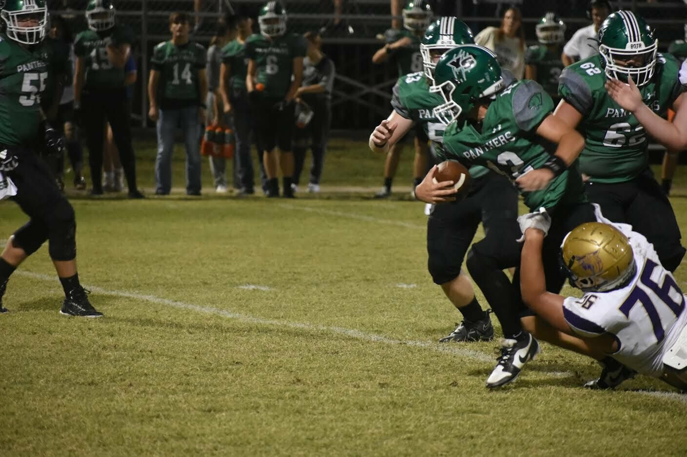 JEFF BRASEL/STAFF


Yellville-Summit quarterback Noah Cantrall is drug down by Berryville's Daniel Roque during play Friday night in Marion County. The Panthers came back to defeat Berryville, 34-27.