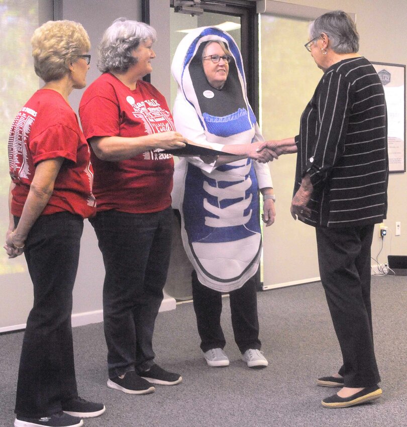 Joanie Corry, from right, thanks Village Walk for Cancer Research co-chairs Clara Nicolosi and Nikki Choyce, and cancer survivor Nancy Belair last Wednesday for their volunteer work for the Village Walk for Cancer Research. 
(Lewis Delavan photo)