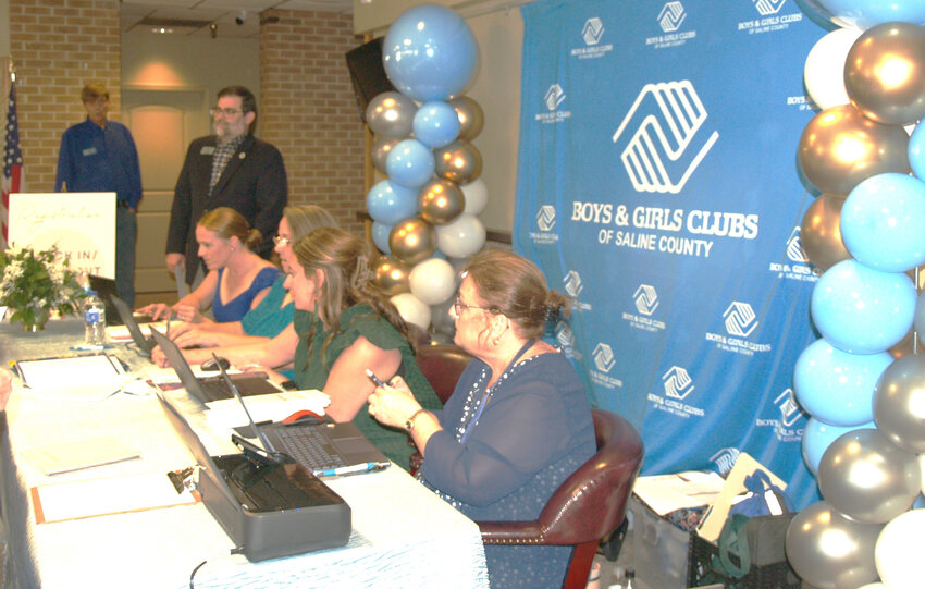 Staff members from the Saline County Boys and Girls Club register guests for the 8th Annual Boys and Girls Club Gala.  Pictured foreground to background are Koleen Lesiak, Krystal Askew, Rayne Ricketts, Emmy Rogers, and Chris Ritchey, CEO of SBGC. (Suzanne Sweeten photos)
