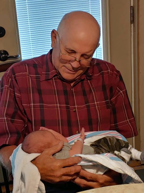 My dad, Mike, holding his first great-grandson, Mason, on Aug. 14, 2020.