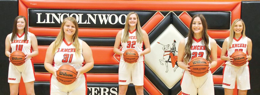 The five seniors on the Lincolnwood High School girls basketball team were honored along with their parents prior to their 49-40 win over Pawnee on Saturday, Feb. 13. From the left are Brittany Slightom, Sophie Rainwater, Katelyn Payne, Cassie Krager and Maggie McClelland.