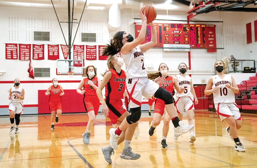 Nokomis' Emma Sneddon goes up for two of her five points during the Lady Redskins' 51-26 victory over Lincolnwood on Saturday, March 6. The win gave Nokomis a 6-0 record and a conference championship in the MSM Conference.