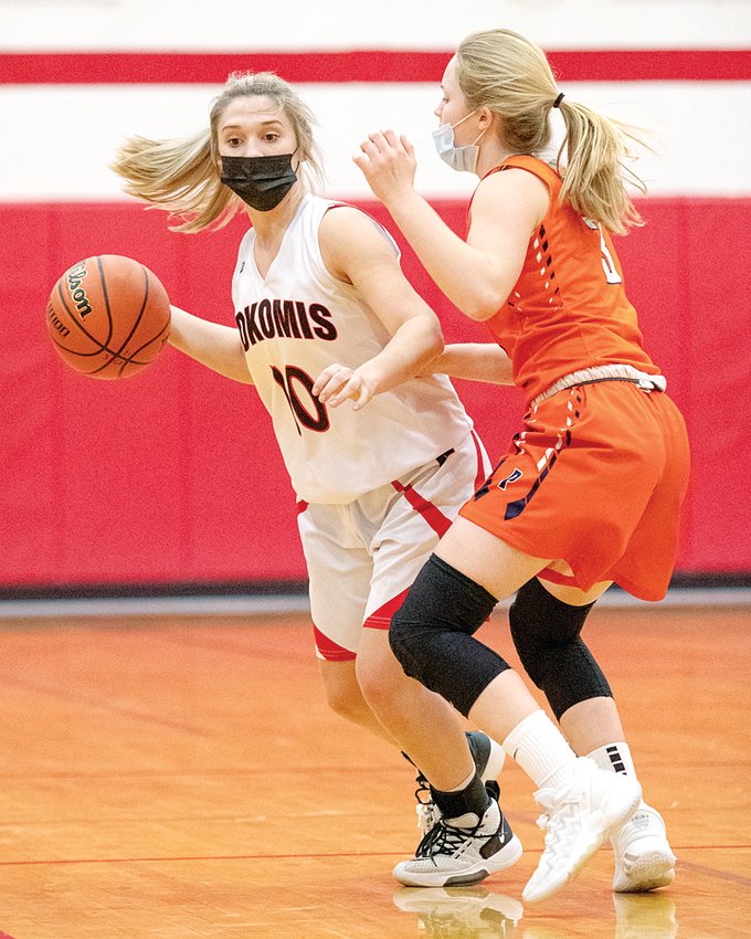 Nokomis senior Mia Fesser brings the ball down the floor against Pana&rsquo;s Anna Beyers during the Redskins&rsquo; senior night game against the Panthers on Wednesday, March 10.