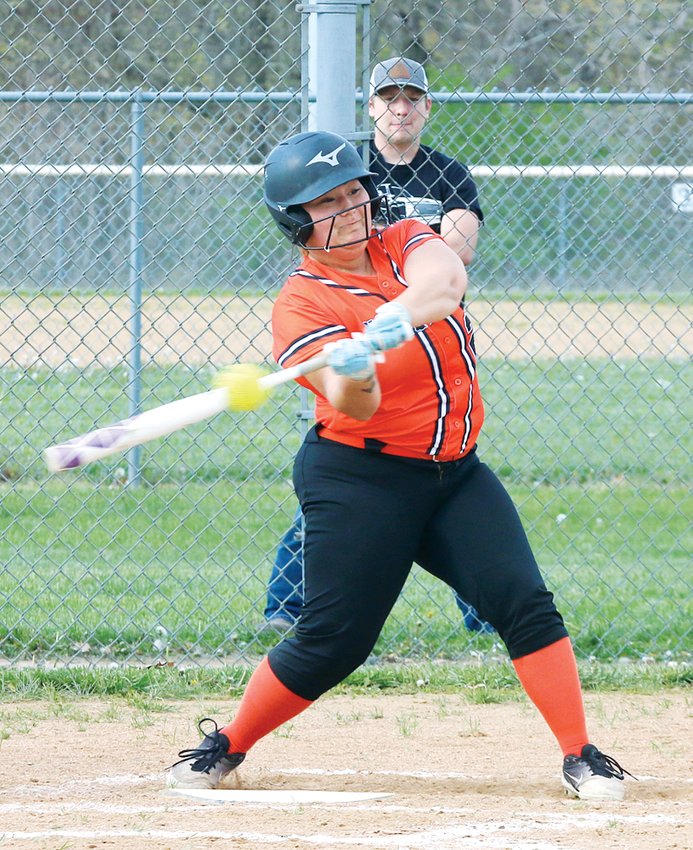 Hillsboro senior Erin Moore takes a cut at a Kylie Nation offering during the Toppers' season opener against Pleasant Plains on Monday, April 19. Nation would be tough to touch on Monday, as she struck out nine and held the Lady Toppers hitless in the Cardinals' 15-0 win in four innings.