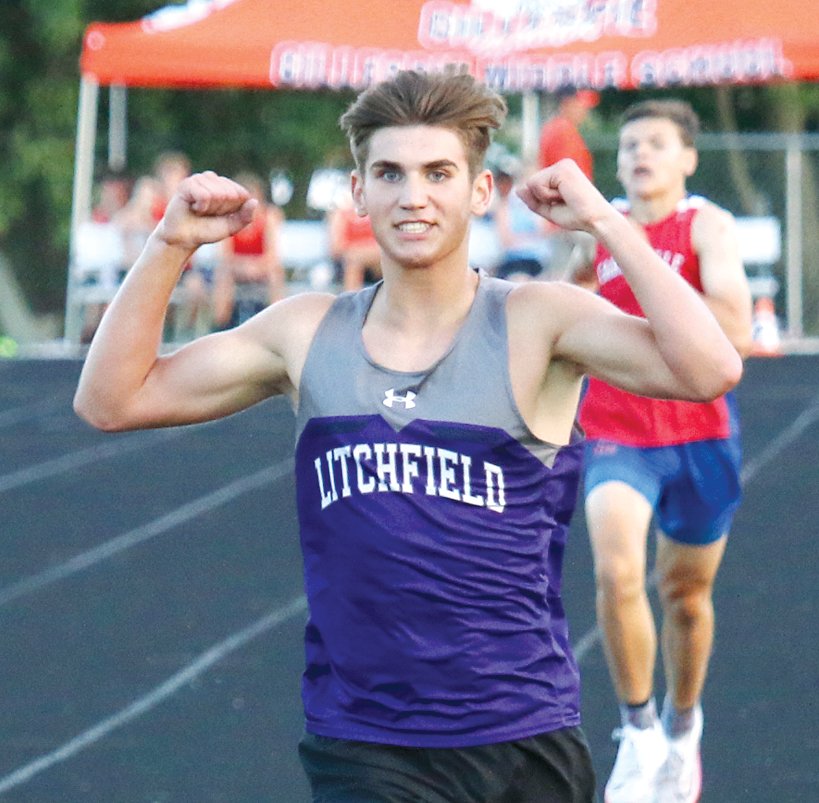 With his closest competition, Carlinville's Will Meyer, a few yards behind him, Litchfield freshman Camden Quarton celebrates as he crosses the finish line of the 1600 meters at the IHSA Gillespie Sectional on June 11.