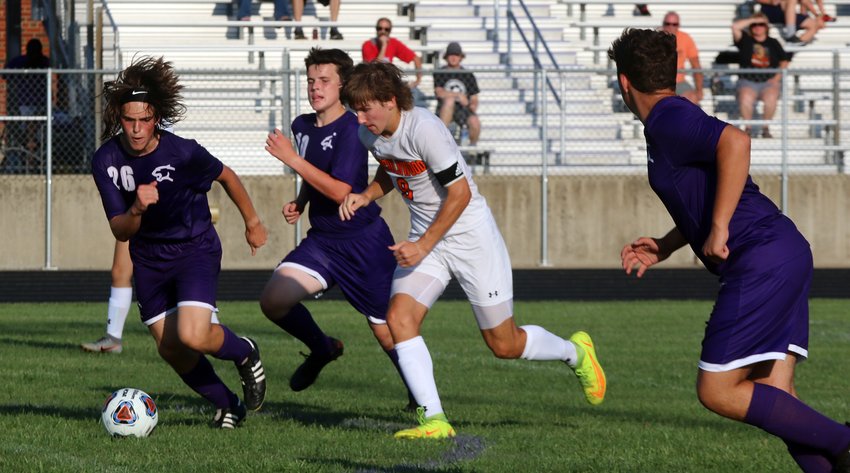 Litchfield's Leo Page (#26) and Anthony Bader (#10) try to track down the ball and Lincolnwood's Elijah Aumann during the Purple Panthers' opening game on Aug. 24. Aumann would break free and score the first of his four goals in Lincolnwood's 6-1 win.