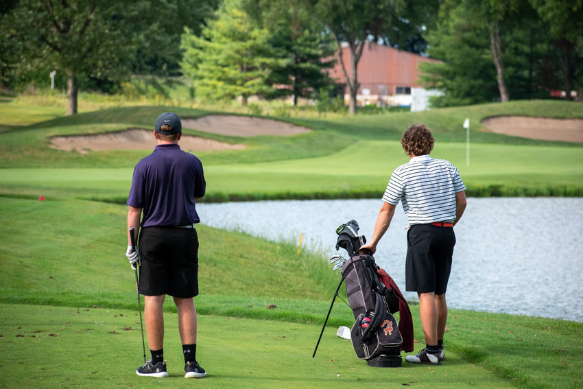 Litchfield's Kelvin Dooley (left) and Hillsboro's Dillon Smail consider their options during their round at The Rail on Tuesday, Aug. 24. Smail was one of three players to tie for the top individual spot, shooting a 2-over-par 38, but Dooley, who shot a 46, and company helped Litchfield edge their rivals 179 to 182.