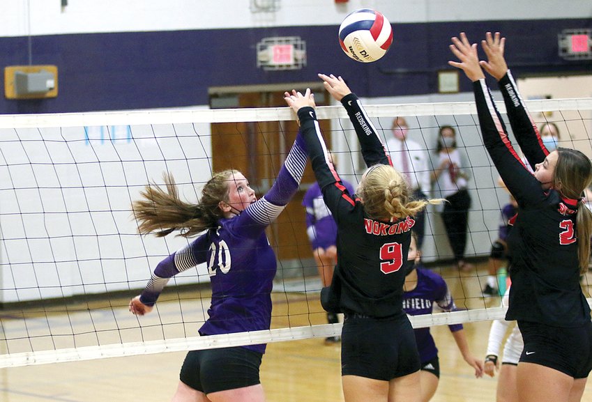 Litchfield's Blair Johnson (#20) tries to tip a shot over the outstretched hands of Nokomis' Addison Dangbar (#9) and Audrey Sabol (#24) during their Montgomery County match-up on Thursday, Aug. 26. The Redskins would carry the momentum from a 25-15 win in game one into game two as they defeated the Panthers 25-16 to pick up the sweep.
