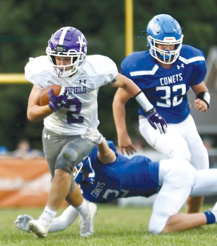 Litchfield's AJ Sypherd shirks a Greenville tackler during the Panthers' game on the Comets' home field on Friday, Sept. 24. Litchfield got 97 yards from Sypherd and had some success running the ball up the middle, but fell to the Comets 49-16.