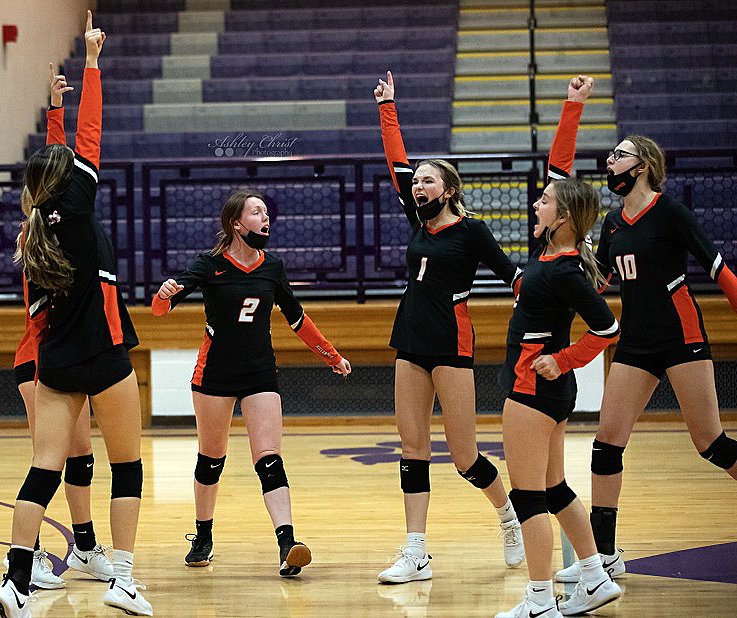 Members of the Hillsboro volleyball team celebrate during their three set win over Litchfield on Wednesday, Oct. 20. The victory evened the season series at 1-1, with the two rivals set to meet in Carlinville on Monday, Oct. 25, in regional play.