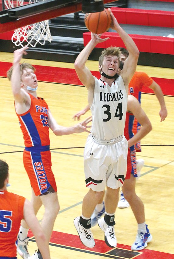 Nokomis' Jake Johnson goes up for two of his eight points in the Redskins' 46-41 upset win over third seeded Flora at the Vandalia Holiday Tournament on Tuesday, Dec. 28. The Redskins would also defeat Father McGivney in pool play as they finished 2-2, with losses to Pana and Shelbyville.