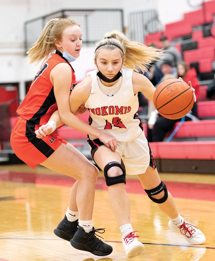 Lincolnwood's Haelee Damm (left) tries to slow down Nokomis' Addison Dangbar during the MSM Conference game between the neighboring schools in Nokomis on Jan. 20. Dangbar had 14 points in the Redskins' 55-14 victory over the Lancers.
