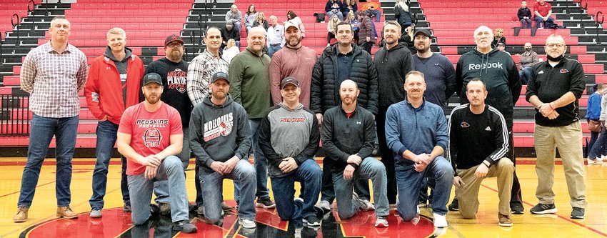 Twenty-five years after a memorable state run, the 1997 Nokomis High School boys basketball team was honored by their alma mater, before the current crop of Redskins defeated Mulberry Grove 48-17 on Saturday, Jan. 29. Team members in front, from the left, are Blake Engelman, Brandon Johnson, Shane Tuetken, Matt Stolte, Craig Reincke, and Dan DeWerff. In the back are Trevor West, Coach Steve Eisenbarth, Aaron Bertolino, Mike Havera, Aaron Jansen, Jeremy Mehochko, Jon Huber, Brian Barnes, Joe Cole, Coach Steve Kimbro and Coach Brian Pesko. The 2022 Redskins have several connections to the 1997 squad, including Pesko, who continues as an assistant coach, and DeWerff, who is now the head coach for Nokomis.