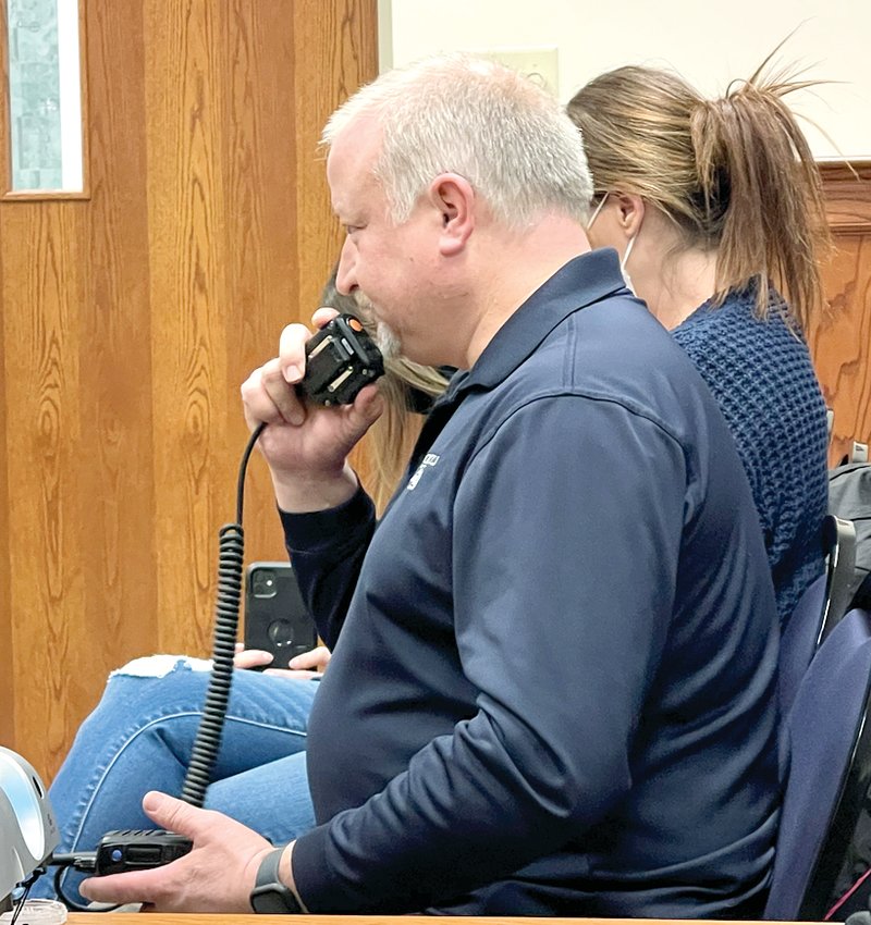 Litchfield Police Sgt. Dan Evans makes his final off-duty call during the Litchfield City Council meeting on Thursday, Feb. 10. Evans, who established the K-9 program for the Litchfield Police Department, retired at the end of January after 25 years with the department.