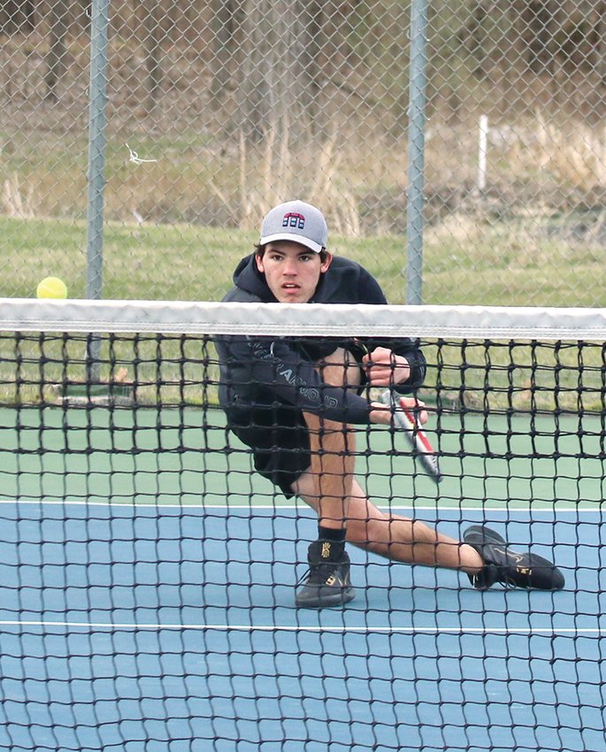 Hillsboro's Dom Haggard started his season off on the right foot with a win over Roxana number one Dakota Hall 6-4, 6-1 in the Toppers' season opener on Tuesday, March 29.