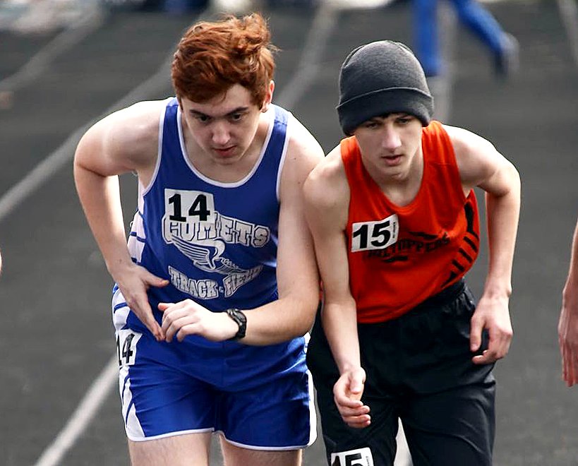 Greenville's Michael Wilson (left) and Hillsboro's Brodie Clinard take off from the starting line in the 3200 meter race at the Greenville Invitational on Saturday, April 2.