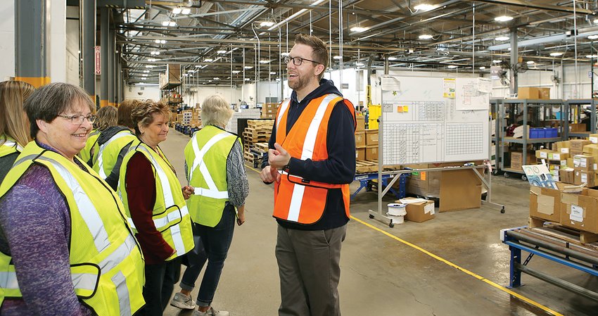 Neil Holderread leads a tour of Sierra retirees through the Litchfield facilities after a rebranding celebration luncheon on Tuesday, April 12.