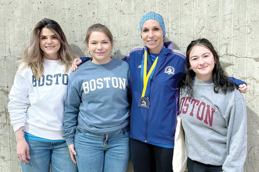 Beckemeyer Elementary School teacher Laura Lessman of Hillsboro finished the Boston Marathon on Monday morning. She is pictured above with her cheering squad. From the left are Brittany Perkins, Alexis Lessman, Laura Lessman and Julia McCarty.